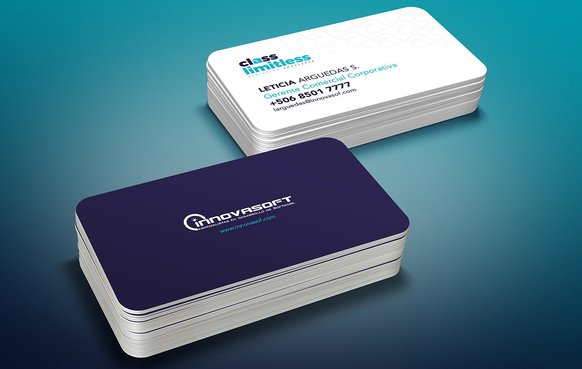 Two stacks of Innovasoft business cards on a teal surface: a white Class Limitless front with contact details and a deep purple back with the logo