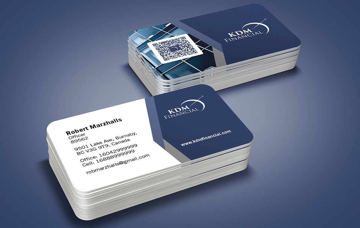 Two stacks of KDM Financial business cards on a blue-grey surface: the front with contact details, the back in navy with the logo and a QR panel