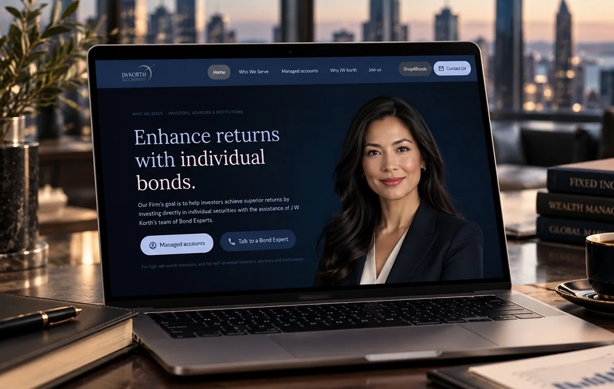 JW Korth & Company home page on a laptop, dark navy: the headline Enhance returns with individual bonds beside a portrait, with buttons for managed accounts and talking to a bond expert